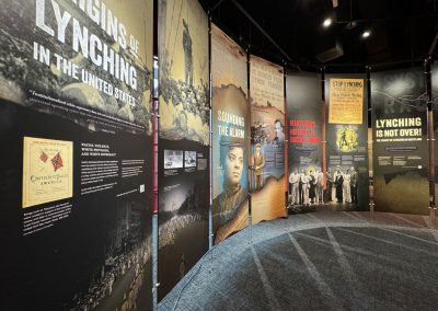 Banners in a museum gallery that talk about the history of lynching.