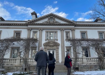 The exterior of a grand late 19th-century mansion.