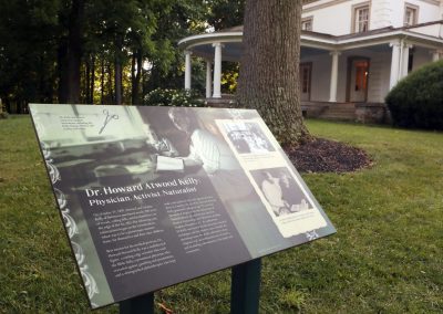 An outdoor sign that says, Dr. Kelly, Naturalist.