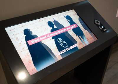 A screen from an interactive that shows the dark silhouettes of figures, along with the text, What Type of Revolutionary Are You?